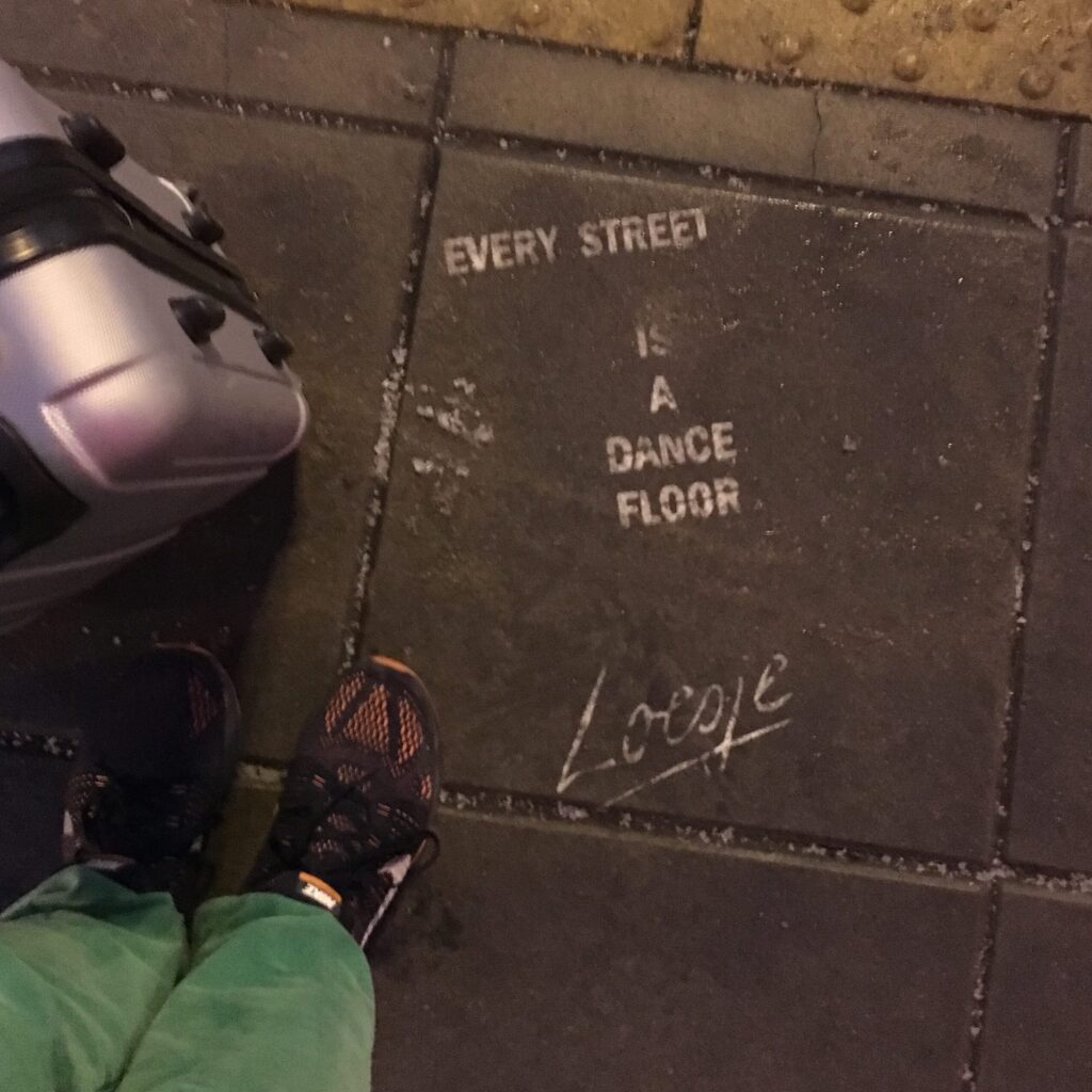 pavement with a motto the street is a dance floor